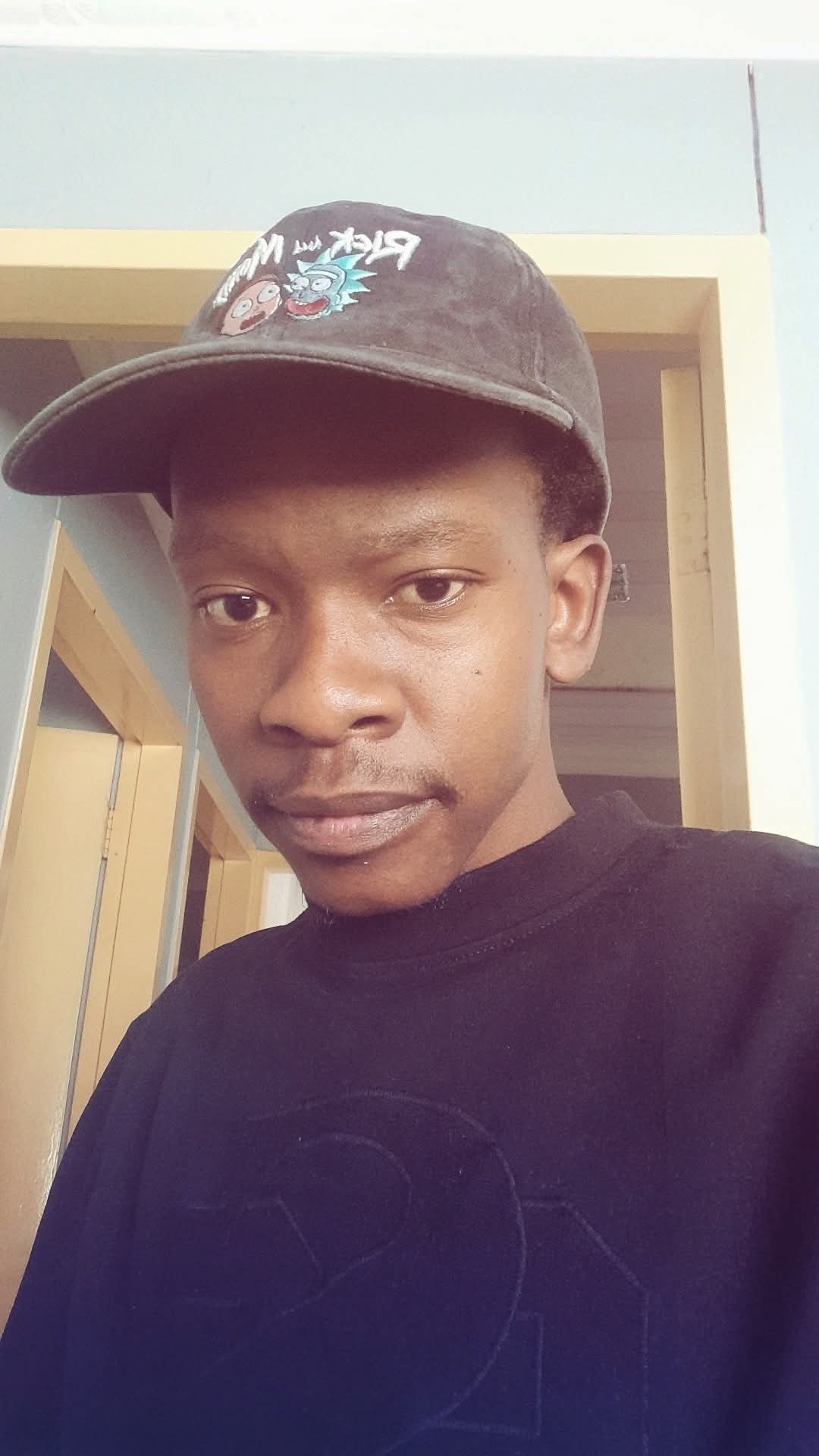 A professional headshot of Gift Mpho.